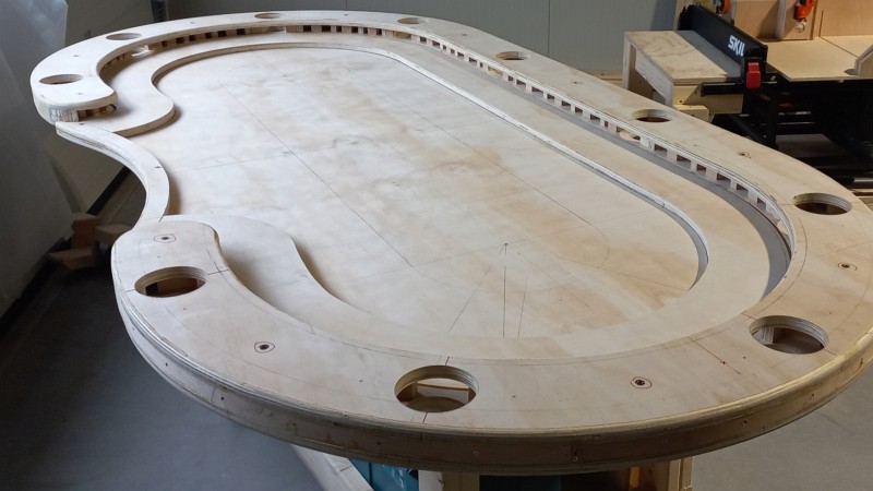 Handcrafted custom poker table with solid wood and premium felt.